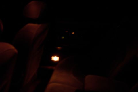 1996 Mercury Grand Marquis - Interior view of a car at night, with illuminated dashboard and seats visible.