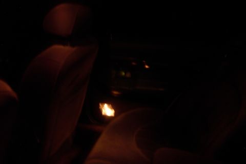 1996 Mercury Grand Marquis - The interior of a car is dimly lit at night, with illuminated dashboard elements visible.