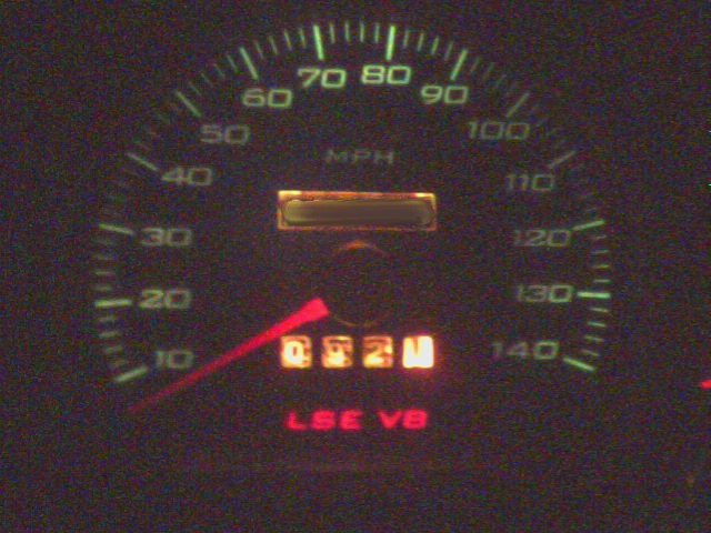Green-lit MPH speedometer with needle near 10 and red 'LSE V8' text