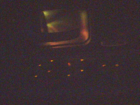 1996 Mercury Grand Marquis - Illuminated door handles and interior panel lights are visible in the dimly lit car interior.