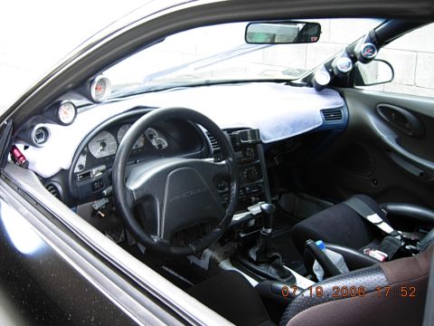 1993 Ford Probe - Customized interior of a 1993 Ford Probe features aftermarket gauges and racing seats.