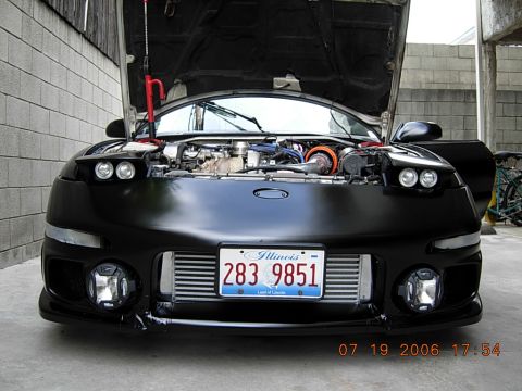 1993 Ford Probe - Front view of a black car with its hood open, revealing the engine and an aftermarket intercooler. The Illinois license plate is visible.