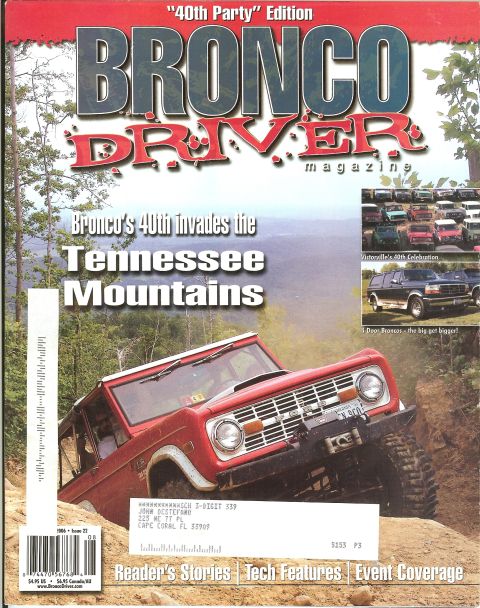 1993 Ford C-350 (Centurion Conversions) - A red Ford Bronco navigates a steep, sandy incline, its off-road capabilities.