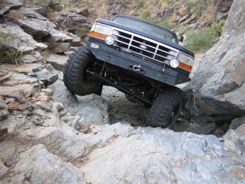 1994 Ford Bronco - Ford Bronco tackling a difficult rocky terrain.