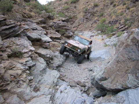 1994 Ford Bronco - A 1966 Ford Bronco tackles a challenging rocky terrain, its off-road capabilities.