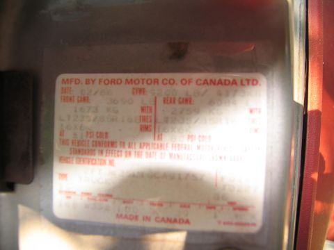 1986 Ford C-350 (Centurion Conversions) - Vehicle identification label shows manufacturing date 02/86 and GVWR 9200 LB.