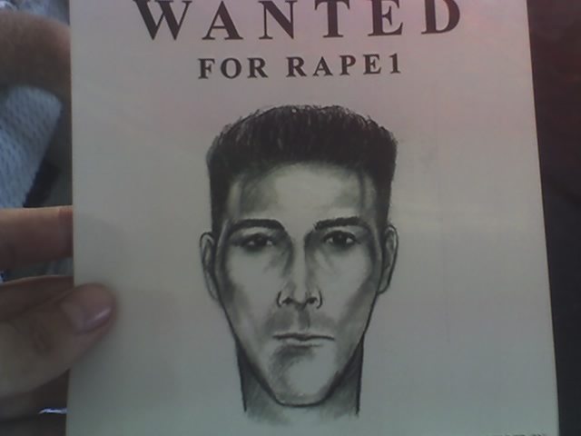 Wanted poster with sketch of a man's face and text 'WANTED FOR RAPE1'
