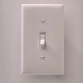 1990 Ford Bronco - A close-up view of a standard light switch mounted on a wall.