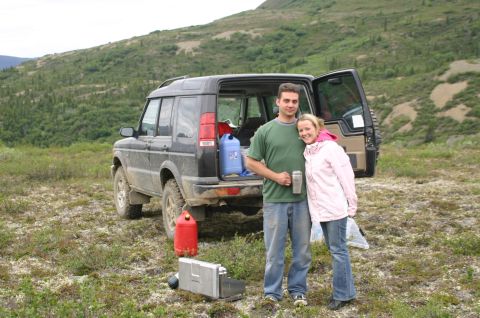 2003 Jeep TJ - Couple poses with their Land Rover Discovery during a trip on the Denali Highway.