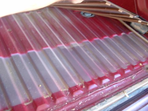 1990 Ford Bronco - Corrugated truck bedliner shows wear and tear.
