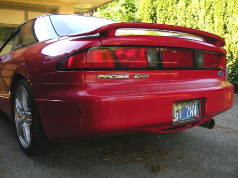 1996 Ford Probe - Rear view of a red 1996 Ford Probe GT 24V, showing the taillights and spoiler.