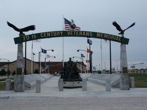 2001 Mercury Grand Marquis - The entrance to the 20th Century Veterans Memorial features an archway, eagle statues, and a central monument.