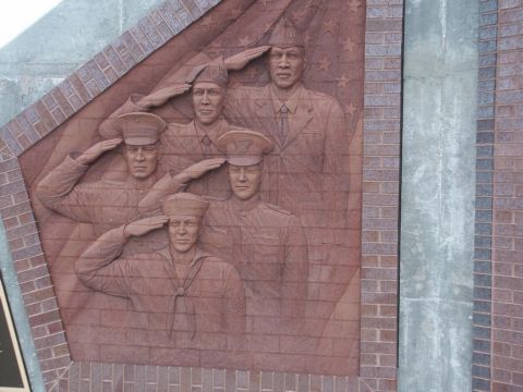 2001 Mercury Grand Marquis - A relief sculpture depicts four soldiers in military uniforms saluting.