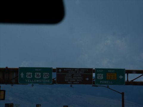 2001 Mercury Grand Marquis - Highway signs indicate directions to Yellowstone, Buffalo Bill Cody's Scenic Byway, and Powell.