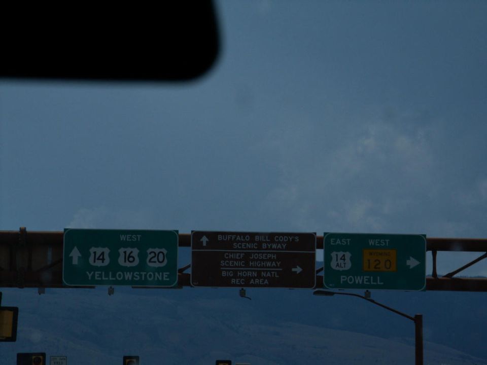 Road signs pointing to Yellowstone, Buffalo Bill Cody's Scenic Byway, Chief Joseph Scenic Highway, and Powell