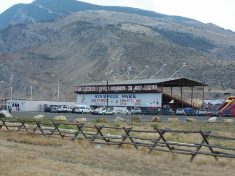 2001 Mercury Grand Marquis - A view of Stampede Park, likely during an event, with numerous vehicles parked in the lot.