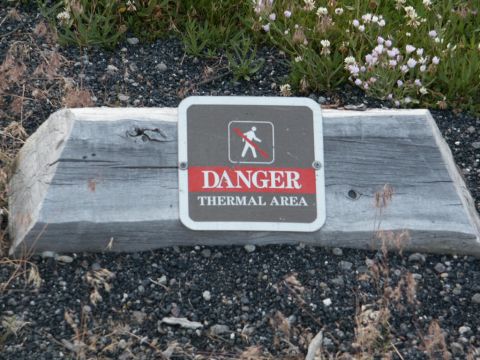 2001 Mercury Grand Marquis - Sign warns of danger in a thermal area, set against a natural background.