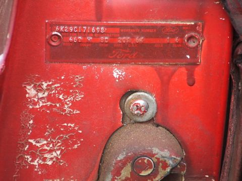 1966 Ford Ranchero - Close-up of a Ford door-jamb warranty data plate stamped 6K29C171698 with body, color, trim, date, D.S.O., axle and trans columns, riveted…