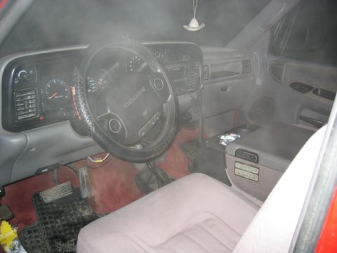 1996 Dodge 2500 - The interior of a 1996 Dodge 2500 pickup truck, the dashboard, steering wheel, and seats.