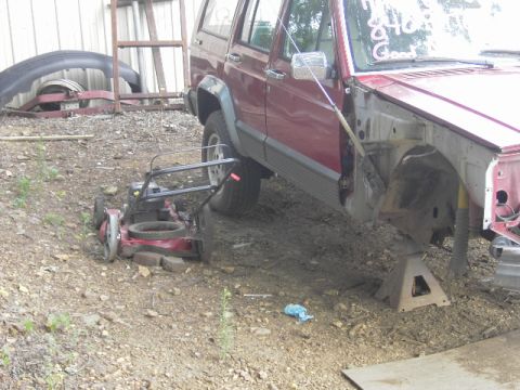 1991 Jeep Cherokee - This 1991 Jeep Cherokee is missing its front end and is supported by jack stands.