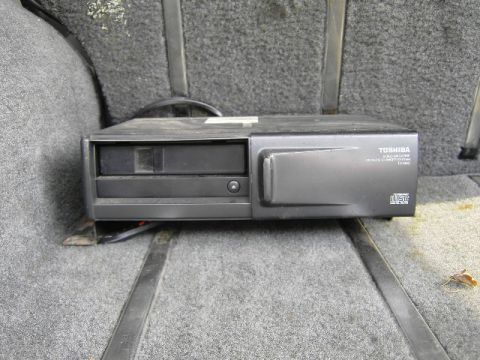 1995 Jeep YJ - Toshiba CD changer installed in the cargo area of a vehicle.