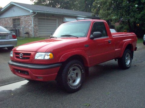 1994 Ford Probe - This red pickup truck, likely a 1998 Mazda B-Series, is shown from a 3/4 front angle.