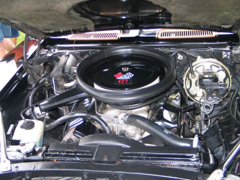 1994 Ford Bronco - Close-up view of a vehicle's engine bay, highlighting the air cleaner assembly.