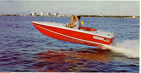 1978 Ford F-250 - A red and white Donzi boat speeds across the water with two occupants at the helm.