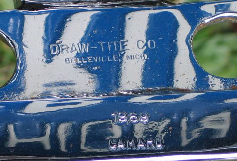 1994 Ford Bronco - Stamped text on a blue metal part reads "DRAW-TITE CO. BELLEVILLE MICH." and "1969 CAMARO".