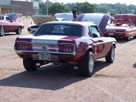 1972 Ford Ranchero - Rear view of a 1967 Ford Mustang Fastback with a "Mustang Muscle" sticker on the window.