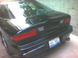 1993 Ford Probe - Rear view of a black 1993 Ford Probe with a license plate visible.
