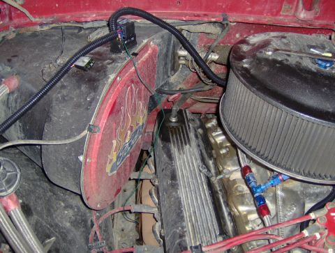 1978 Ford Bronco - Close-up of an engine bay showing custom wiring and an air filter assembly.