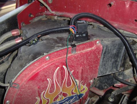 1978 Ford Bronco - Wiring and a relay are visible in the engine bay, with a red cover flame decals.