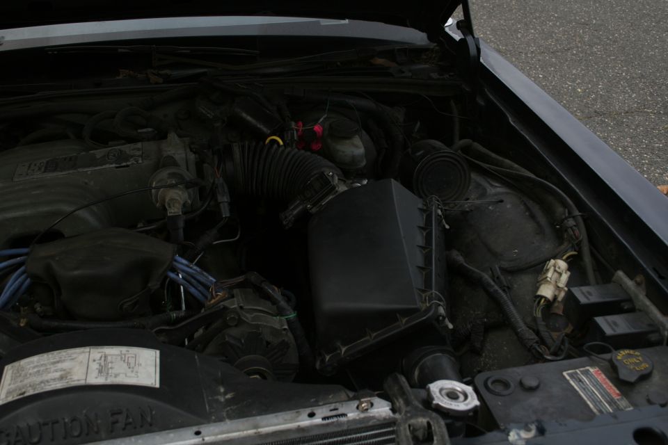 Engine bay with air intake and wiring