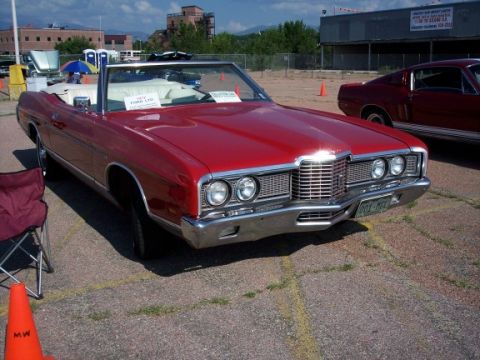 1972 Ford Ranchero - 1972 Ford LTD convertible and a red Ford Mustang are parked in an outdoor lot.