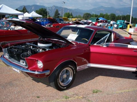 1972 Ford Ranchero - A red 1968 Mustang GT500KR is displayed with its hood and door open, revealing the engine bay.