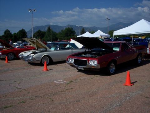 1972 Ford Ranchero - A red 1972 Ford Ranchero is displayed with its hood open at an outdoor event.