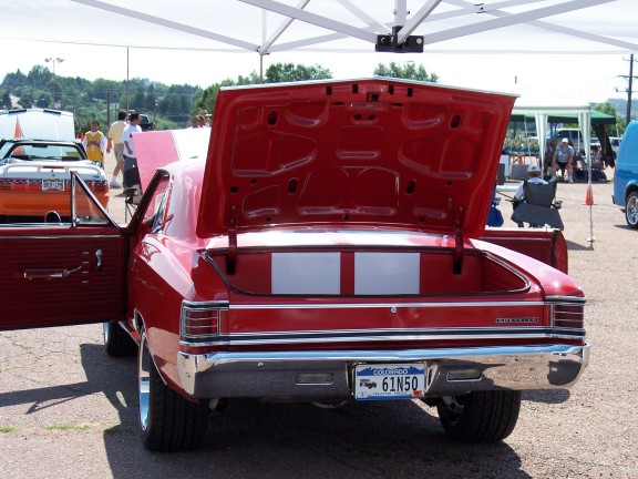 Red 1967 Chevrolet Chevelle SS coupe, rear view, trunk open. License plate 61N50