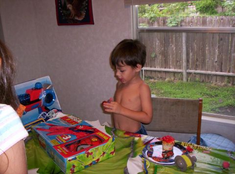 1986 Ford Bronco - A young boy celebrates his birthday with cake and presents.
