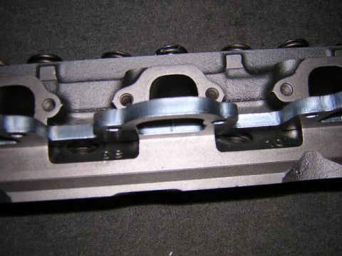 1979 Ford Bronco - Engine cylinder head detail with exhaust ports visible.