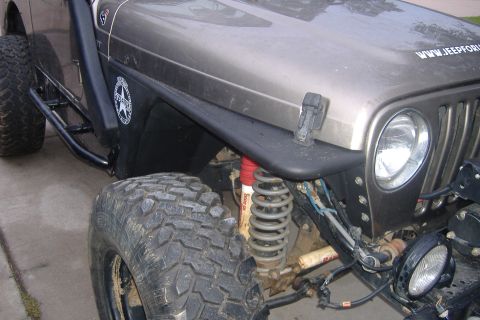 2004 Jeep Wrangler - This modified Jeep Wrangler features large off-road tires and custom fender flares.