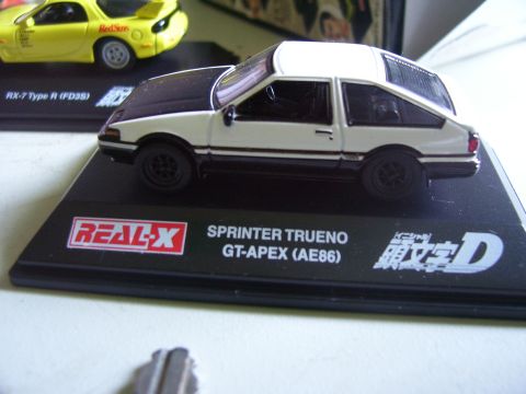 1994 Ford Probe - A toy model of a Sprinter Trueno GT-APEX (AE86) is displayed next to a yellow toy RX-7.
