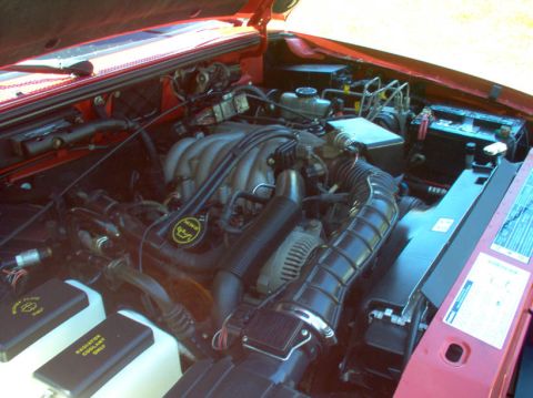 1994 Ford Probe - Engine bay details including V6 intake manifold and air intake system.