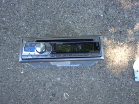 1994 Ford Probe - A car stereo is shown from a top-down perspective on a concrete ground.