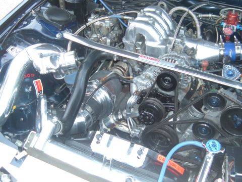 1989 Ford Probe - Custom engine bay modifications visible, including a strut bar and intake system.