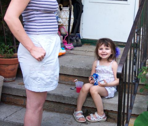1979 Ford F-250 - A young girl sits on porch steps with a drink and toy, while a woman stands nearby.