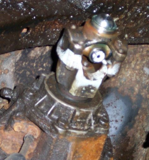 1979 Ford F-250 - Close-up view of a universal joint and driveshaft component, likely from a truck or heavy equipment.