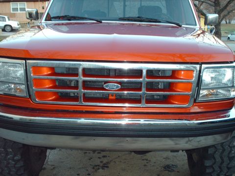 1991 Ford F-350 - Front view of an orange Ford F-350 truck, showing its grille and bumper details.