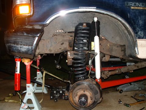 1995 Ford Bronco - Front suspension of a 1995 Ford Bronco, showing the installation of new shocks and springs.
