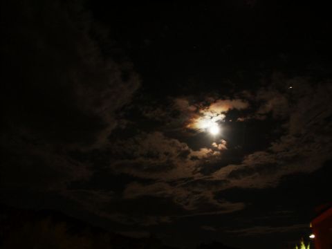 2001 Mercury Grand Marquis - A full moon shines through scattered clouds, illuminating the night sky. The Supermotors.net logo is visible in the lower right corner.